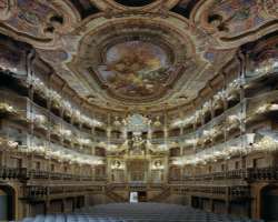 Giuseppe Galli Bibiena and his son Carlo were credited with designing the magnificent wooden interior. You can still see the box theatre though curtai